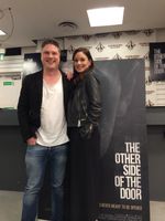 [Sarah Wayne Callies and Johannes Roberts Signing 'The Other Side of The Door' Posters (Product Image)]