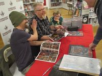 [Kek-W and Dave Kendall signing The Fall of Deadworld in Bristol (Product Image)]