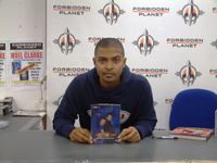 [Noel Clarke signing Doctor Who Series 2 Box Set (Product Image)]