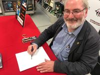 [Chris Riddell Signing Guardians Of Magic (Product Image)]