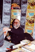[Terry Pratchett signing Witches Abroad (Product Image)]